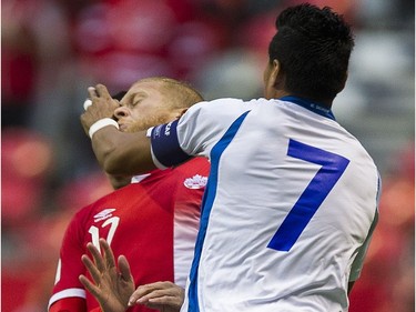 Canada's Marcel De Jong gets a hand in the face from El Salvador's Darwin Ceren.