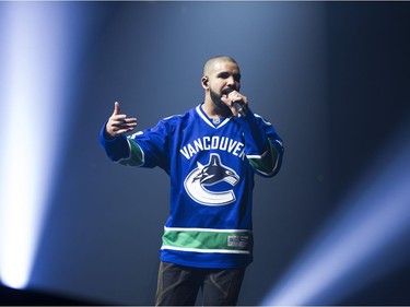 Drake performs on stage in a Vancouver Canucks jersey at Rogers Arena, Vancouver, September 17, 2016.