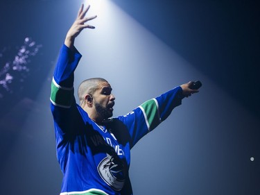 Drake performs on stage in a Vancouver Canucks jersey at Rogers Arena, Vancouver, September 17, 2016.