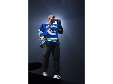 Drake performs on stage in a Vancouver Canucks jersey at Rogers Arena, Vancouver, September 17, 2016.