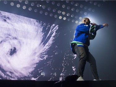 Drake performs on stage in a Vancouver Canucks jersey at Rogers Arena, Vancouver, September 17, 2016.