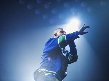 Drake performs on stage in a Vancouver Canucks jersey at Rogers Arena, Vancouver, September 17, 2016.