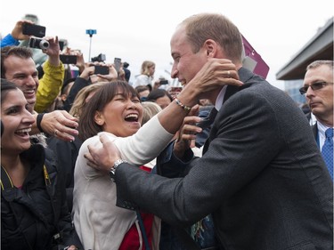 Tina Coligado reacts after getting a hug from Prince William, Duke of Cambridge in Vancouver, BC, September, 25, 2016.