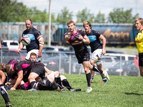Assmus in charge of the a Canadian Rugby Championship game between the Prairie Wolfpack and the Ontario Blues.