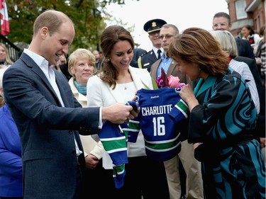 VICTORIA, BC - OCTOBER 01:  Catherine, Duchess of Cambridge and Prince William Duke of Cambridge is presented with personalised sports shirts for Prince George and Princess Charlotte by BC Governor Christy Clark at Cridge Centre for the Family on the final day of their Royal Tour of Canada on October 1, 2016 in Victoria, Canada. The Royal couple along with their Children Prince George of Cambridge and Princess Charlotte are visiting Canada as part of an eight day visit to the country taking in areas such as Bella Bella, Whitehorse and Kelowna