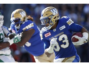 Winnipeg Blue Bombers' Andrew Harris (33) runs against the Saskatchewan Roughriders during first half CFL Banjo Bowl action, in Winnipeg on September 10, 2016. The timing couldn't be better for Andrew Harris to return to the football field after a three-game absence. The Blue Bombers running back will suit up for the first time against his former B.C. Lions team when the clubs clash Saturday afternoon at Investors Group Field.