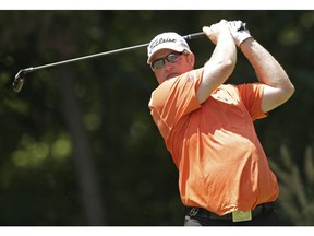 Brad Fritsch, of Canada, watches his tee shot on the second hole during the third round of the Wyndham Championship golf tournament in Greensboro, N.C., Saturday, Aug. 16, 2014.