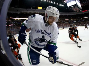 Alexander Edler of the Canucks skates to the puck during the first period against the Ducks.