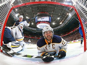 Brian Gionta slides into the net behind Robin Lehner of the Buffalo Sabres during their NHL game against the Vancouver Canucks at Rogers Arena.  (Photo by Jeff Vinnick/NHLI via Getty Images)