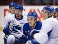 Jake Virtanen, Sven Baertschi, Nikita Tryamkin and Bo Horvat at Canucks practice on Wednesday.