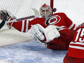 Carolina Hurricanes goalie Eddie Lack (31) makes a save during the third period of an NHL hockey game against the New York Islanders, Saturday, Feb. 13, 2016, in Raleigh, N.C.