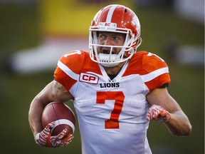 Fraser runs in an interception for a touchdown against the Calgary Stampeders in July.