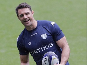 FILE  - In this Friday, May 13, 2016 file photo,  Racing 92's Dan Carter, of New Zealand, holds the ball during a training session in Decines, near Lyon, central France. French newspaper L'Equipe reported Friday that prohibited substances were found in samples given by Carter, Rokocoko and another player after the final of the French club competition on June 25.