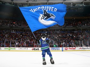 Fin, the Vancouver Canucks' mascot, salutes the fans after their game against the Edmonton Oilers at Rogers Arena April 11, 2015 in Vancouver, British Columbia, Canada.