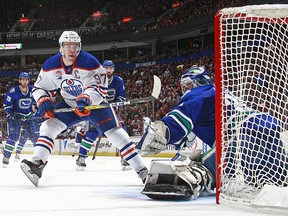 Ryan Miller #30 of the Vancouver Canucks makes a save on a breakaway by Connor McDavid #97 of the Edmonton Oilers during their NHL game at Rogers Arena October 28, 2016 in Vancouver, British Columbia, Canada. Edmonton won 2-0.