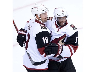 Arizona Coyotes' Shane Doan, left, and Anthony Duclair celebrate Doan's goal against the Vancouver Canucks during the second period of a pre-season NHL hockey game in Vancouver, B.C., on Monday October 3, 2016.