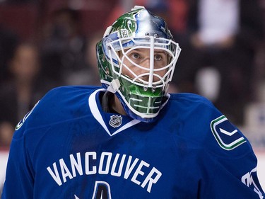 Vancouver Canucks' goalie Jacob Markstrom, of Sweden, watches the puck during the first period of a pre-season NHL hockey game against the Arizona Coyotes in Vancouver, B.C., on Monday October 3, 2016.