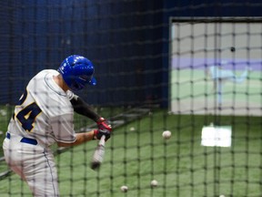 A batter takes a cut in a batting zone at the new UBC Baseball Indoor Training Centre, a $4-million state-of-the-art facility.