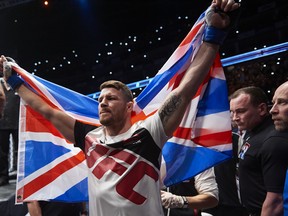 British fighter Michael Bisping walks to the ring for his fight with Anderson Silva of Brazil (not pictured) in their middleweight bout at the Ultimate Fighting Championship (UFC) Fight Night event in London on February 27, 2016. NIKLAS HALLE'N/AFP/Getty Images