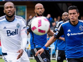 Vancouver Whitecaps defender Kendall Waston (4), Earthquakes defender Victor Bernardez (5) and midfielder Darwin Ceren (17) chase the ball in the first half at Avaya Stadium in San Jose, Calif., on Sunday John Hefti/USA TODAY