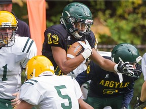Argyle Pipers' Devin O'Hea battle his through the Langley Saints defence Friday in North Vancouver.