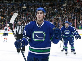 Jake Virtanen of the Canucks skates to the bench after scoring during their NHL game against the Florida Panthers.