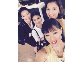 Christina Ling, a flight attendant instructor with the Canadian Tourism College (bottom), with, from left, Riza Gumpac (student), Quennie Rose (student) and Leah Fajardo (instructor).