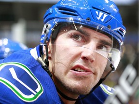 Alexandre Burrows #14 of the Vancouver Canucks looks on from the bench during their NHL game against the St. Louis Blues at Rogers Arena October 18, 2016 in Vancouver, British Columbia, Canada.