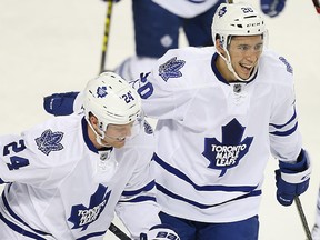 Toronto Maple Leafs Peter Holland and Frank Corrado celebrate a goal against the Calgary Flames last season.