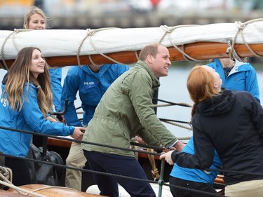 The Duke of Cambridge helps to hoist the sails on a tallship, in Victoria on Saturday, October 1, 2016.