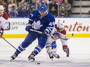 Toronto Maple Leafs Morgan Rielly and Montreal Canadiens Jeremiah Addison in action at the Air Canada Centre on Sunday.