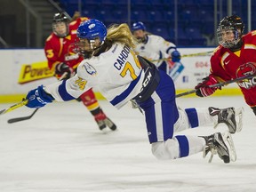 UBC Thundernirds' Kathleen Cahoon (left) is hooked by Calgary Dinos' Madison Turk during Canada West women's hockey action over the weekend at Doug Mitchell Arena. UBC swept two games from Calgary to improve to 2-1 on the season. (Richard Lam, UBC athletics) [PNG Merlin Archive]