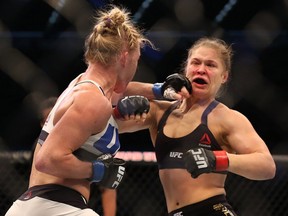 MELBOURNE, AUSTRALIA - NOVEMBER 15:  Ronda Rousey of the United States (R) and Holly Holm of the United States compete in their UFC women's bantamweight championship bout during the UFC 193 event at Etihad Stadium on November 15, 2015 in Melbourne, Australia.