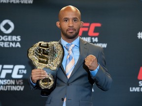 Flyweight Champion Demetrious Johnson poses for a during a press conference for UFC 174, April 22, 2014 at Rogers Arena.