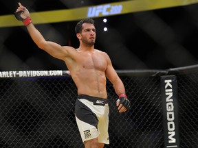 Gegard Mousasi celebrates his victory over Thiago Santos (L) during the UFC 200 event at T-Mobile Arena on July 9, 2016 in Las Vegas, Nevada.
