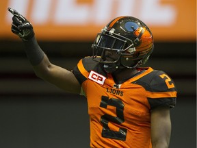 B.C. Lions kick returner Chris Rainey gestures to the crowd during a CFL game at B.C. Place Stadium.