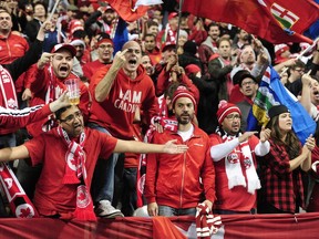 Jubilant Canada fans celebrate after beating Honduras during FIFA World Cup action at B.C. Place in 2015.