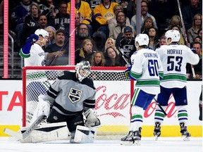 LOS ANGELES, CA - OCTOBER 22:  Henrik Sedin #33 of the Vancouver Canucks celebrates his goal with Markus Granlund #60 and Bo Horvat #53 behind Peter Budaj #31 of the Los Angeles Kings to trail 3-2 during the second period at Staples Center on October 22, 2016 in Los Angeles, California.