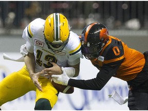 B.C. Lions defensive back Loucheiz Purifoy sacks Edmonton Eskimos QB Mike Reilly on Saturday.