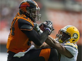 B.C. Lions receiver Emmanuel Arceneaux hauls in a pass for a touchdown while defended by Edmonton Eskimos cornerback Tyler Thornton Saturday night at B.C. Place. Manny had eight catches for 132 yards and two touchdowns in the Lions 32-25 victory.