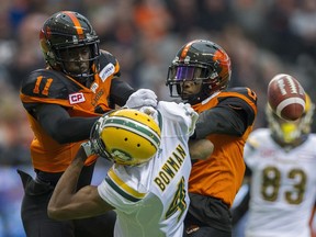 VANCOUVER October 22 2016.  Pressure by BC Lions #11 Mike Edem and #0 Loucheiz Purifoy keep Edmonton Eskimos #4 Adarius Bowman from hauling in a pass in a regular season CFL football game at BC Place, Vancouver, October 22 2016.  ( Gerry Kahrmann  /  PNG staff photo)  ( Prov / Sun Sports ) 00045818A  [PNG Merlin Archive]