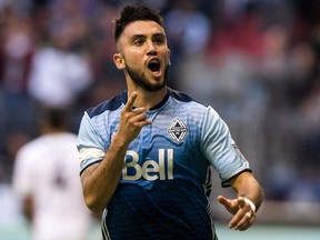 Vancouver Whitecaps captain Pedro Morales celebrates his goal against the Seattle Sounders Sunday. He was later sent off with a red card.