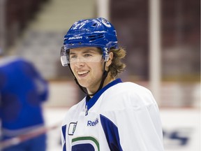 Vancouver Canucks blueliner Ben Hutton is his smiley self at team practice on Thursday. The team’s NHL regular season starts on Saturday.