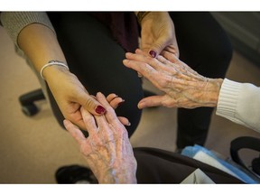 DELTA, B.C.: January 14, 2016   Holly Reandy a therapeutic recreation aide at Northcrest Care Centre in Delta, B.C. massages the hands of one of the residents as part of a touch therapy practice Thursday January 14, 2016   (see story by Kim Pemberton)  (Photo by Ric Ernst/ PNG)  TRAX #: 00041195A [PNG Merlin Archive]