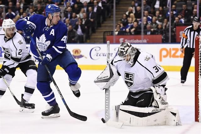 Los Angeles Kings goalie Peter Budaj (31) makes a save in front of Toronto Maple Leafs centre Leo Komarov (47) as Kings defenceman Alec Martinez (27) defends during second period NHL hockey action in Toronto on Tuesday, November 8, 2016. The Los Angeles Kings' world was momentarily rocked with about 35 seconds left in the first period of their first game this season.Jonathan Quick, their two-time Stanley Cup-winning goaltender, Conn Smythe winner and Vezina Trophy nominee, injured his groin and