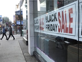 Shoppers on Robson Street during Black Friday sales in 2014. British Columbians are expected to be cautious this year with their purchasing, both in person and online.