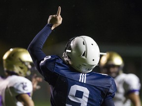 Notre Dame quarterback Steven Moretto pays a special tribute by pointing skyward after scoring touchdowns for the Jugglers.