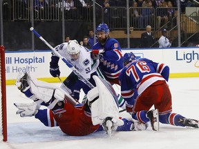 Bo Horvat tries to jam one past Henrik Lundqvist in the third period Tuesday night at Madison Square Garden. A few blocks away, Donald Trump was celebrating too.