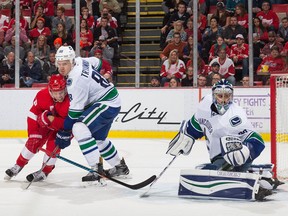 Justin Abdelkader of the Red Wings battles with Nikita Tryamkin.