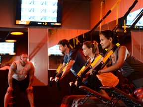 Fitness workouts are a mix of cardio and strength training, using a combination of free weights, treadmills, rowing machines, and TRX suspension training throughout different intervals of the workout.
